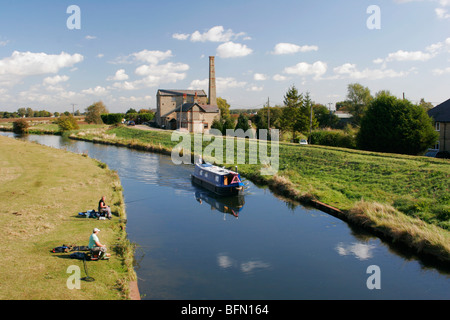 A narrowboat on the River Great Ouse at the Stretham Old Engine, Cambridgeshire, England Stock Photo