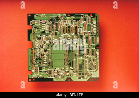 PCB ; Electronics printed circuit board on red background Stock Photo