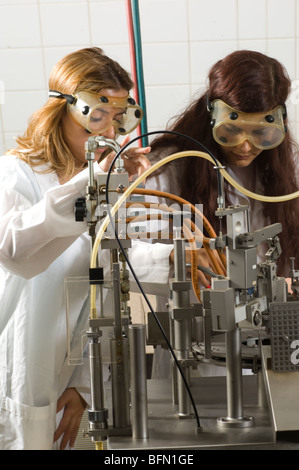 Two Pharmacy students working on a machine inside lab at Beirut Arab University Lebanon Middle East Stock Photo