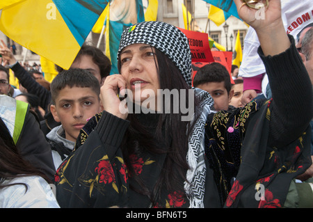 Celebrating Newroz the Kurdish New Year - banned in Turkey - in London, Woman with headscarf in crowd Stock Photo