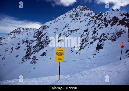 Danger sign marking an off piste area on Rendl, in the Ausrian ski resort of St Anton Stock Photo