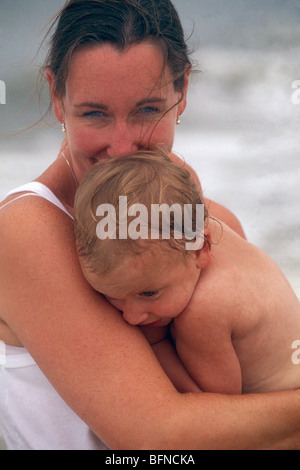 Mother holding her young boy who has autism Stock Photo