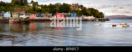 Panoramic photo of sea front and harbourside of Tobermory, Isle of Mull, Scotland taken on a bright but cloudy day Stock Photo