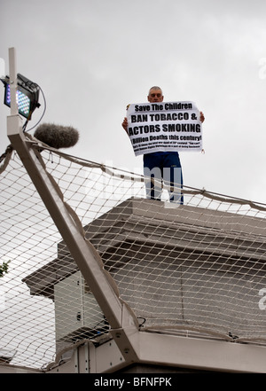 A man holding a banner as part of Antony Gormley's Fourth Plinth Project, London Stock Photo