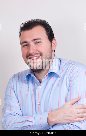 Happy man arms folded looking at camera Stock Photo