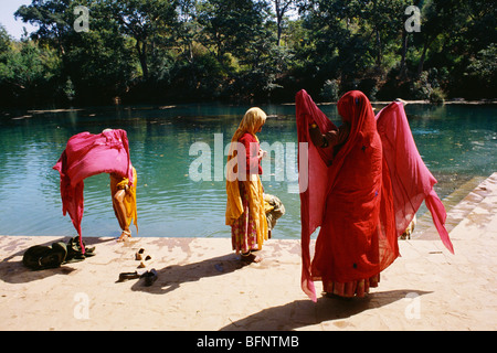 Indian women bathing in Mandakini River in Chitrakoot Kumbh Fair at Satna Uttar Pradesh India Stock Photo