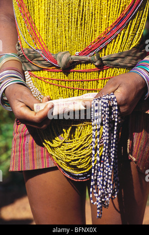 HMA 61789 : Bonda tribal lady holding ten rupees in hand ; Orissa ; India Stock Photo