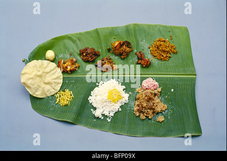 Indian lunch on banana leaf ; Nattukottai Chettiar wedding ; Chettinad ; Sivaganga ; Pudukottai ; Tamil Nadu ; India ; asia Stock Photo