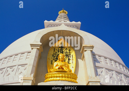 Gilded statue of Buddha ; Vishwa Shanti Stupa ; Rajgir ; Bihar ; India ; asia Stock Photo