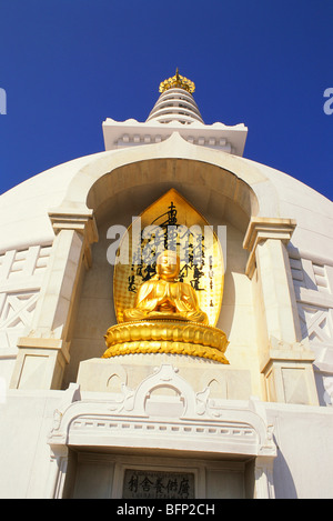 Gilded statue of Buddha ; Vishwa Shanti Stupa ; Rajgir ; Bihar ; India ; asia Stock Photo