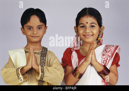 Boy and girl dressed as Bengali couple hands folded namaste welcome pose india MR#502&501 indian children fancy dress Stock Photo