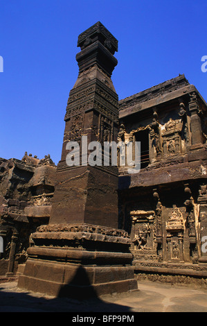 Hindu cave No16 ; Dhwajasthambha & richly carved facade of Kailash temple ; Ellora ; Aurangabad ; Maharashtra ; India Stock Photo