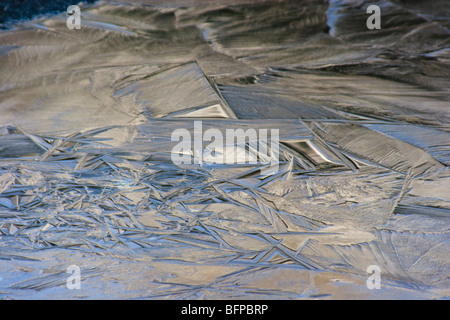 Ice formations on Lake Louise caused by melting ice during the day and again freezing during the night, create beautiful pattern Stock Photo