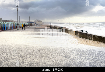 Seaspray is blown over onto Brighton promenade in a storm Stock Photo