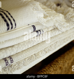 A pile of folded cotton towels and linen Stock Photo