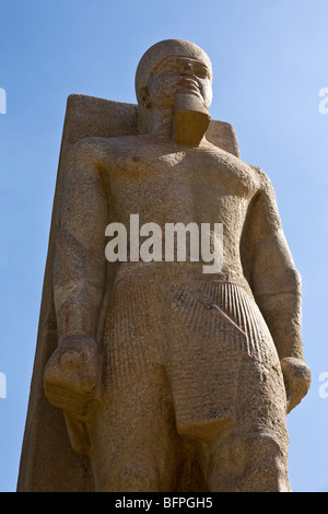 Vertical shot of statue of Ramesses II within the museum at the remains of Memphis in the village of Mit Rahina, Egypt Stock Photo