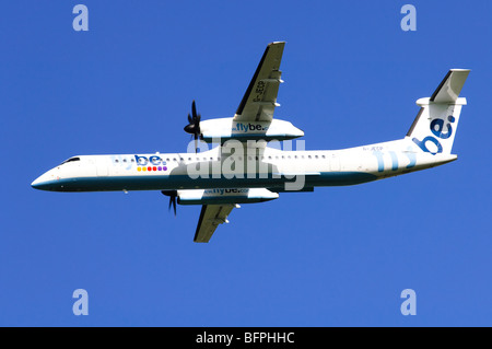 Bombardier Dash 8 operated by Flybe banking after take off from Birmgham Airport, UK. Stock Photo