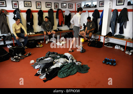 A footballers changing room with dirty kit piled on the floor UK Stock Photo