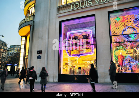 Paris, France, People Street, Night, French Luxury  SHopping, Fashion Shop, Front Window Display LVMH Louis Vuitton store, designer label, mode labels Stock Photo