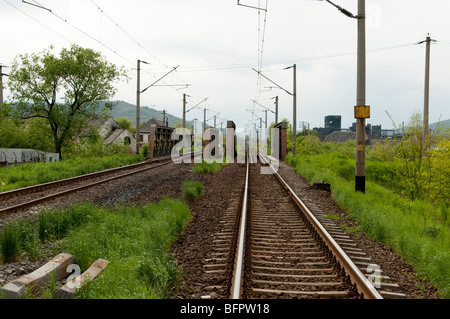 Railway line and bridge in Europes most polluted town Copsa Mica Romania Eastern Europe Stock Photo