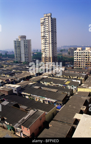 MMN 66644 : Skyscraper surrounded by slum ; Akurli Village ; Kandivali ; Bombay Mumbai ; Maharashtra ; India Stock Photo