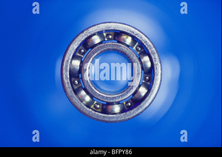 VHM 66704 : Concept ; dot of dot com ball bearing on blue background Stock Photo