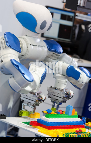 'Motoman' robots produced by Yaskawa, at the International Robot Exhibition 2009, in Tokyo, Japan. Stock Photo