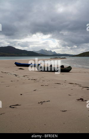 Two Sevylor Inflatable canoes on a spit of beach extending from Rabbit Islands, Tongue Bay near Tongue, Lairg, Scotland Stock Photo