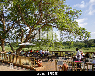 Tourists on the viewing deck in Skukuza overlooking the Sabie River in the Kruger National Park Stock Photo