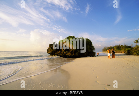 Couple walking on the beach Stock Photo