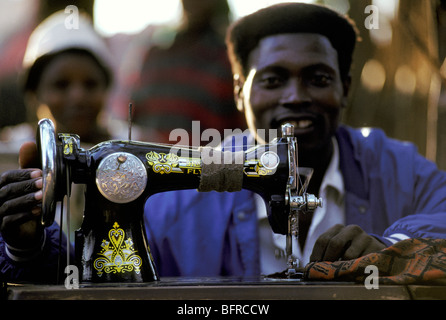 Man sewing at the market Stock Photo