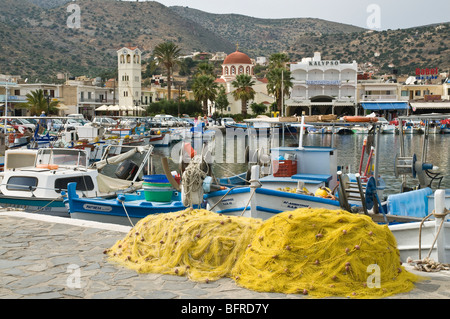 Boats and fishing nets at the pier of the town at sunset, Bol