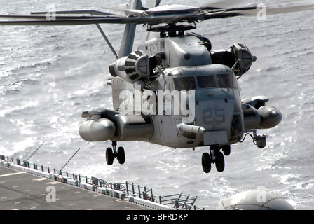 A CH-53E Super Stallion helicopter takes off from USS Makin Island. Stock Photo