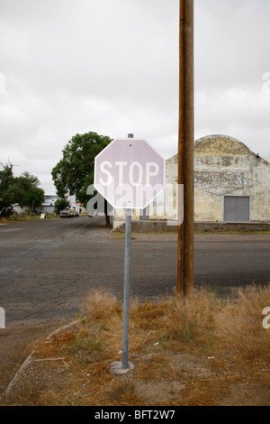 Faded Stop Sign at Corner, Marfa, Presidio County, West Texas, Texas, USA Stock Photo