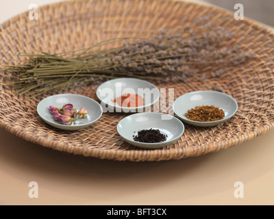Dried Flowers, Roots and Spices on Woven Tray Stock Photo