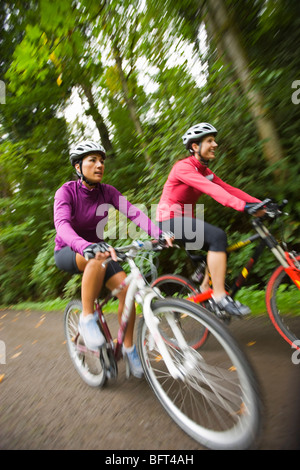 Women Riding Bikes in Forest Stock Photo