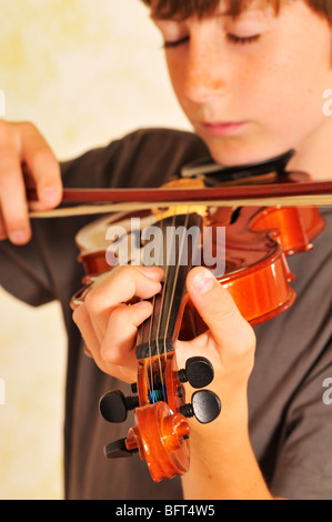 Boy Playing the Violin Stock Photo