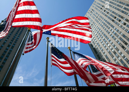 American Flags at Rockefeller Center, GE Building in the Background, NYC, New York, USA Stock Photo
