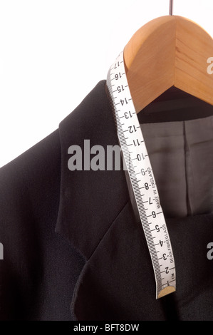 Suit hanging wooden coat hanger with tailors tape measure