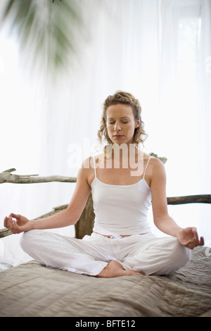 middle-aged woman doing yoga Stock Photo