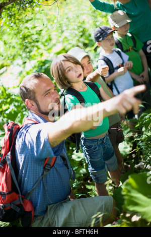 teacher and pupils at the wood Stock Photo