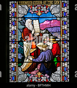 Detail of a stained glass window depicting Moses with the Ten Commandment tablets, Wilton Parish Church, Wilton, Wiltshire
