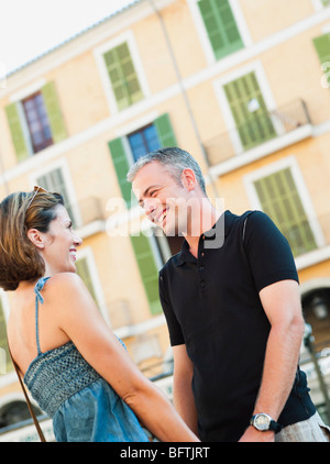 couple holding hands smiling Stock Photo