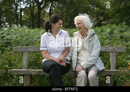 Nurse holding hand of elderly woman Stock Photo