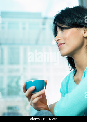 Woman drinking coffee Stock Photo