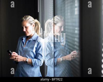 Woman looking at her cellphone Stock Photo