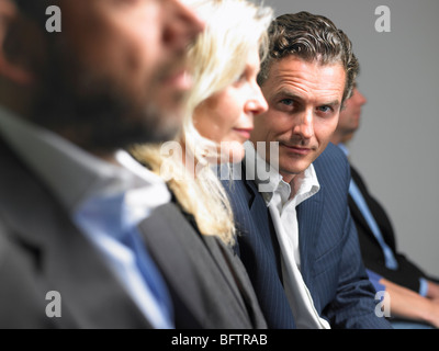 Man looking at camera during conference Stock Photo