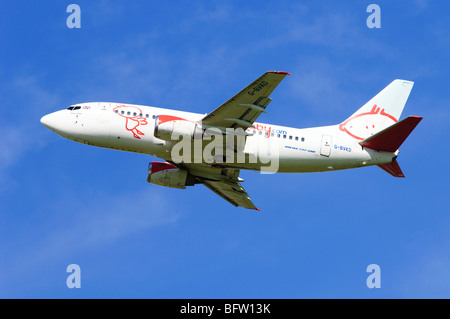 Boeing 737 operated by BMI Baby climbing our from take off at Birmgham Airport, UK. Stock Photo