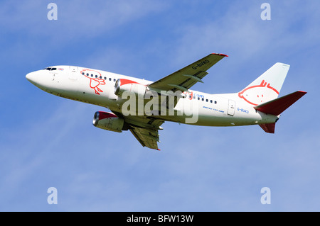 Boeing 737 operated by BMI Baby climbing our from take off at Birmgham Airport, UK. Stock Photo