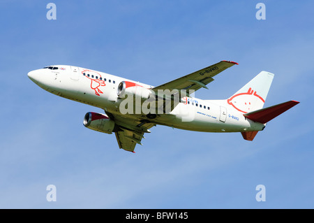 Boeing 737 operated by BMI Baby climbing our from take off at Birmgham Airport, UK. Stock Photo